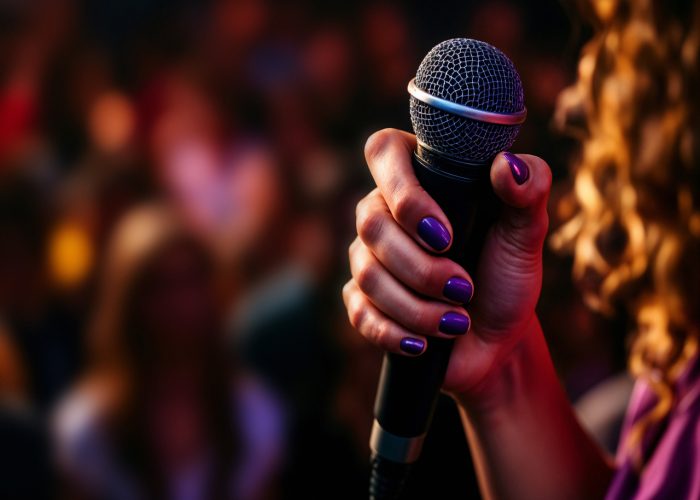woman-holding-microphone-stage-2